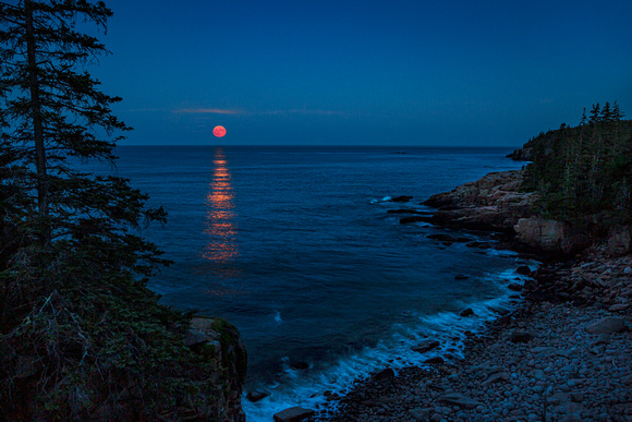 Full Buck Moon (July) rises over Monument Cove